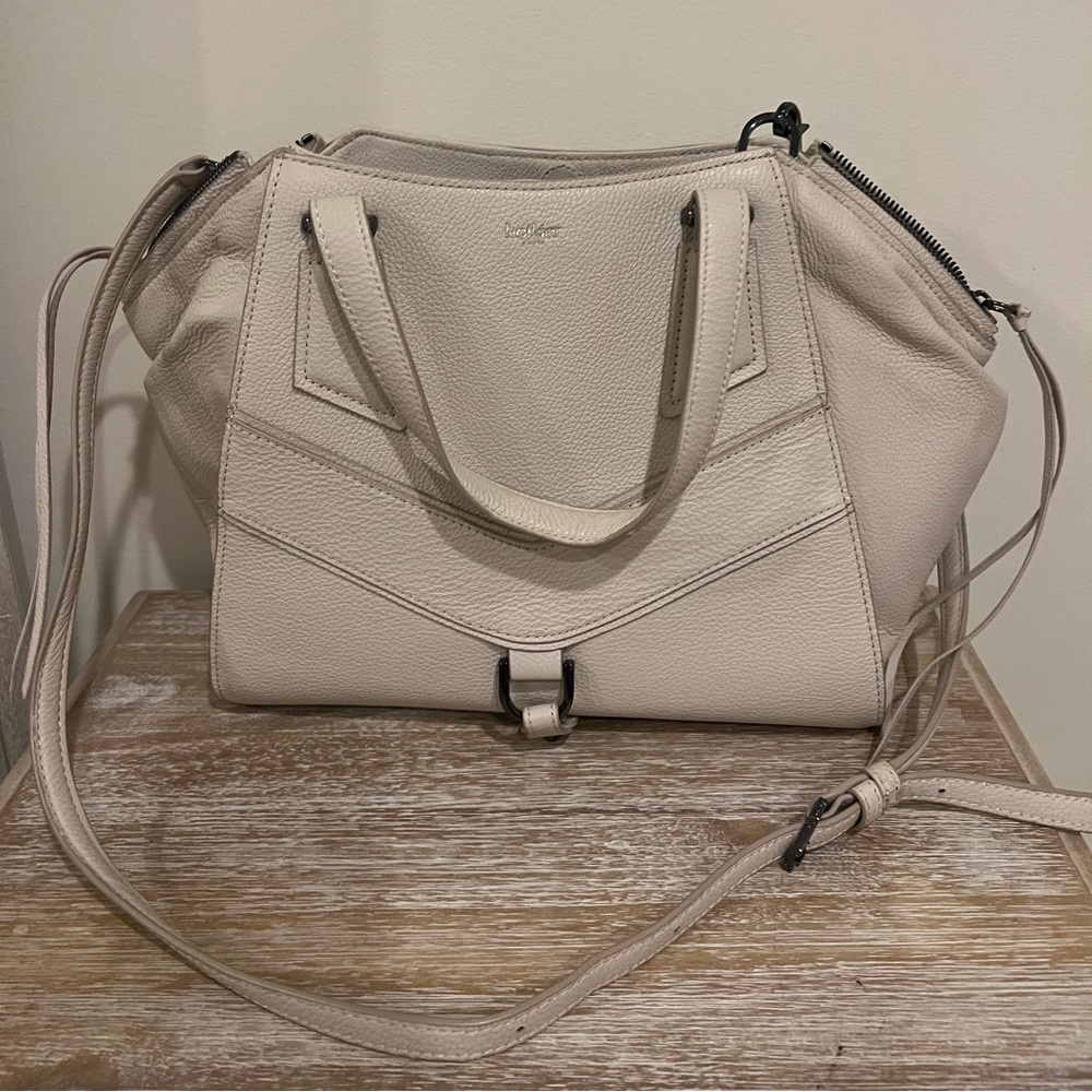 Never used Botkier handbag. Given as gift and never used. Cream leather